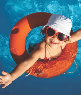 Girl in life vest floating in pool at Club Aqua, AIPL DreamCity Ludhiana