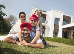 Family enjoying in front of a house at AIPL DreamCity Ludhiana township project in Ludhiana Punjab