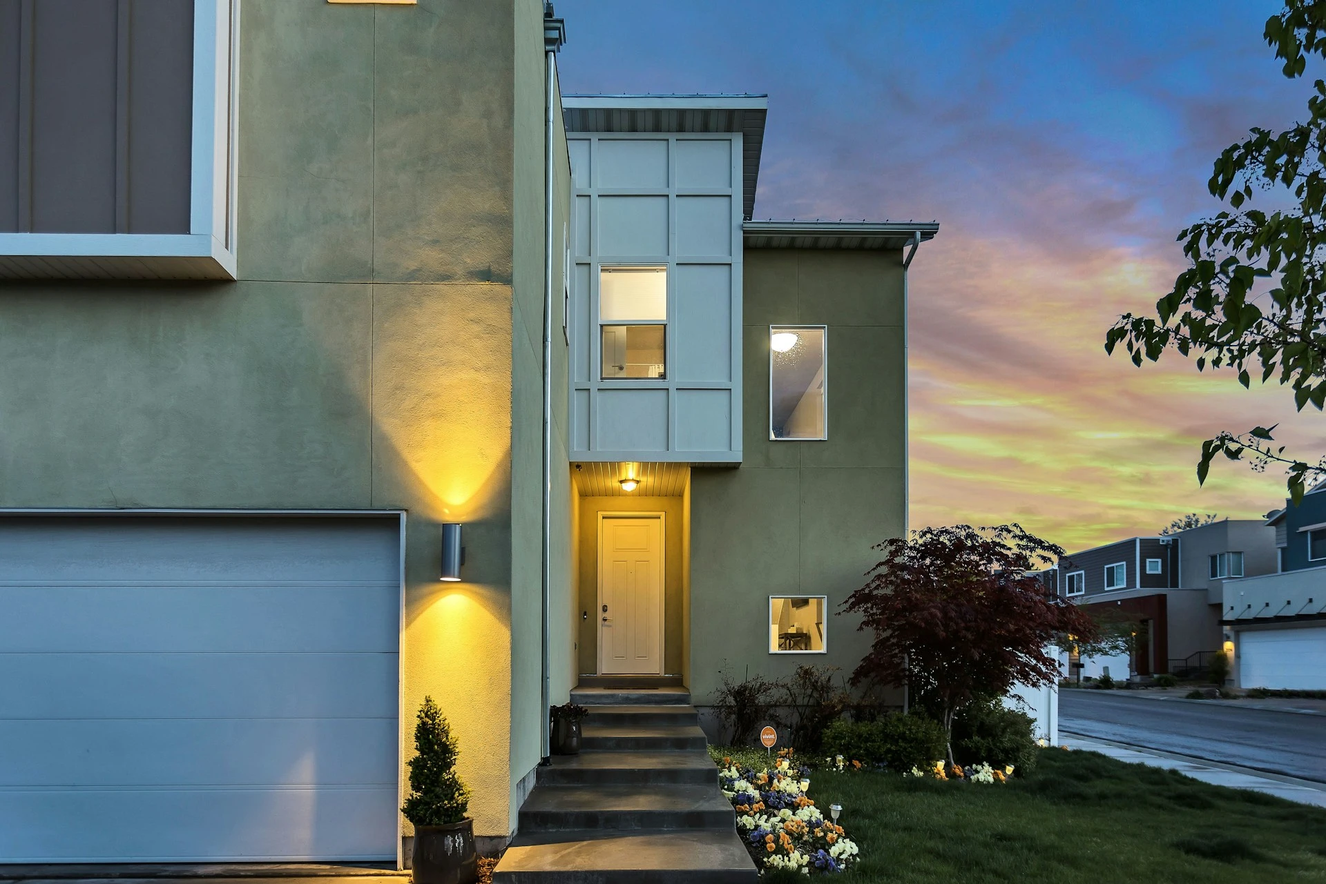 A safe, well-lit modern home with garage and driveway